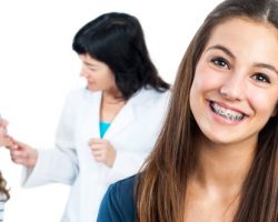 Young Teenage Girl wearing traditional braces | The Foehr Group in Bloomington, IL | Dr. Wolf