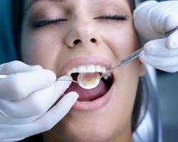 Woman's Teeth Examined by a Dentist | The Foehr Group in Bloomington, IL | Dr. Wolf